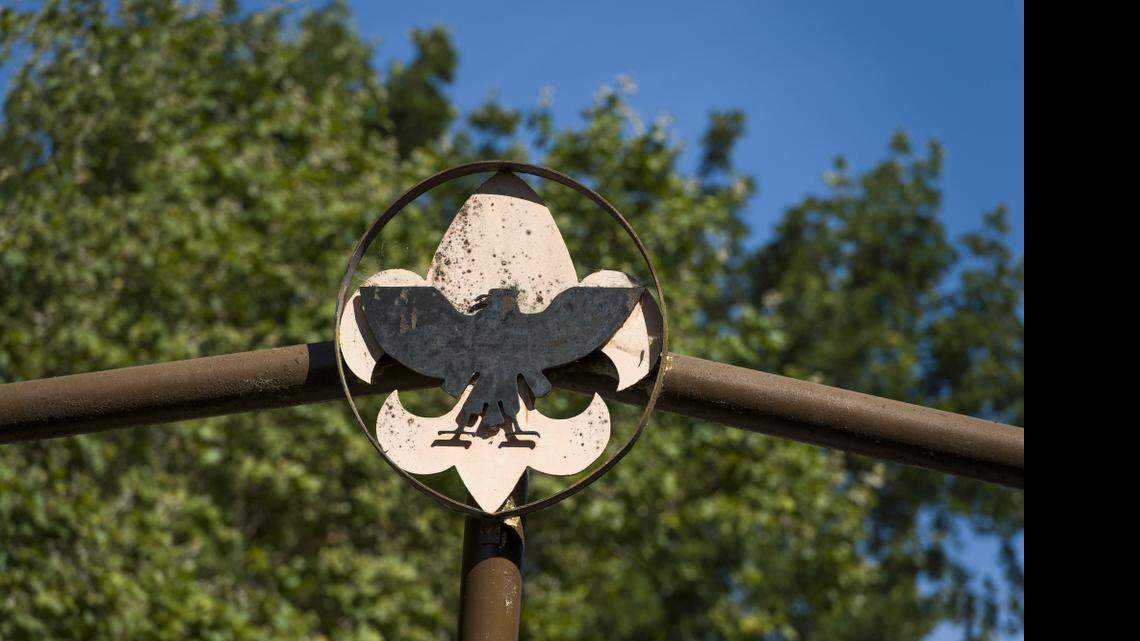 The Boy Scout logo sits atop the gate entering Camp Pollock in 2013, which was formerly operated by Boy Scouts of America.