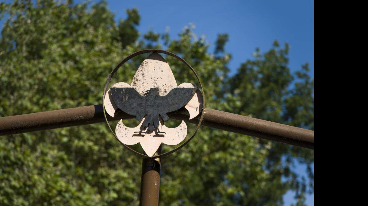 
The Boy Scout logo sits atop the gate entering Camp Pollock in 2013, which was formerly operated by Boy Scouts of America. 

