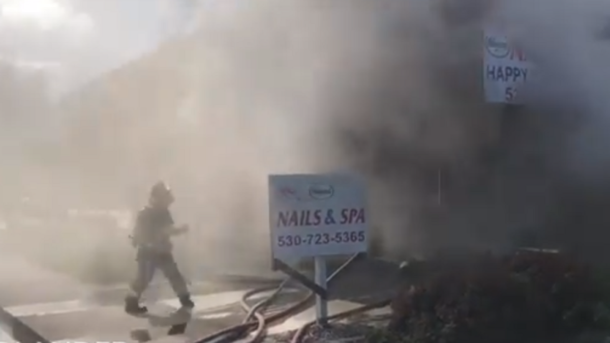 Woodland firefighters requested a second alarm after encountering dense black smoke and heavy fire at Hollywood Nails and Spa in the 100 block of West Main Street on Friday morning, April 28, 2018. Crews from several neighboring departments were summoned and firefighters were able to prevent the fire from spreading to adjoining businesses.