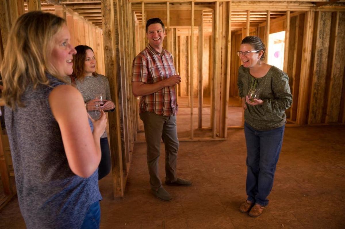 The Leonard family organized a “framing party” to celebrate the rebuilding of their home. “It’s coming together!” Cindy told friends Stephanie Parry, Jessyca Lytle and Cameron Parry as she gave them a tour of the new house.