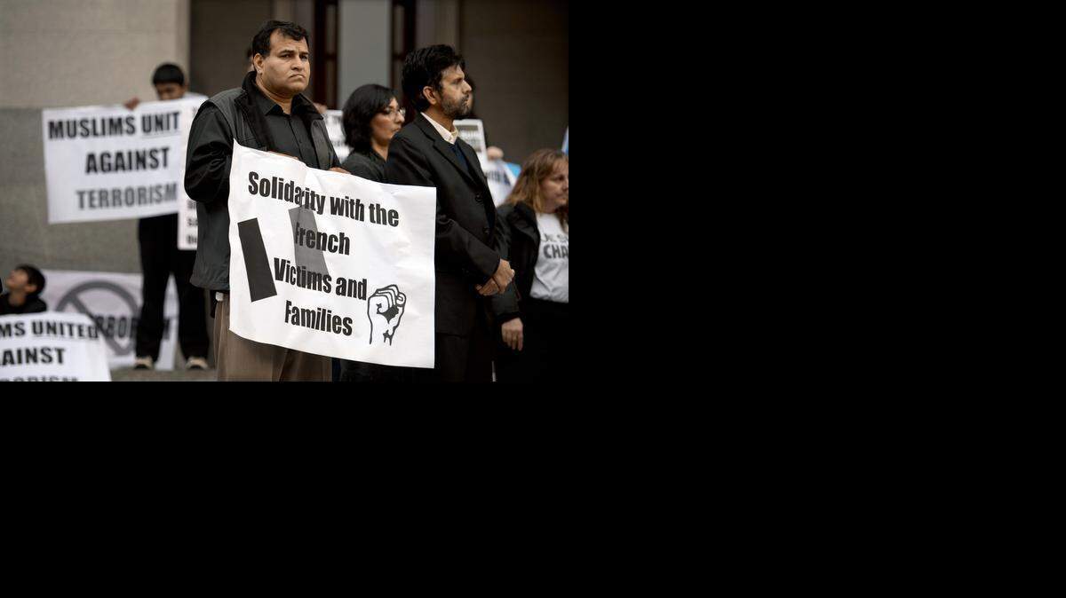 
Sacramento Muslims from throughout the region, including Javaid Iqbal, center, of American Muslim Voice Foundation, hold a peace rally on the west steps of the state Capitol on Friday, January 9.
