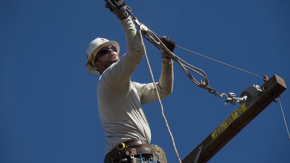 Apprentice lineman Darin Floyd works on an electrical line at the SMUD Power Academy in Sacramento last year.