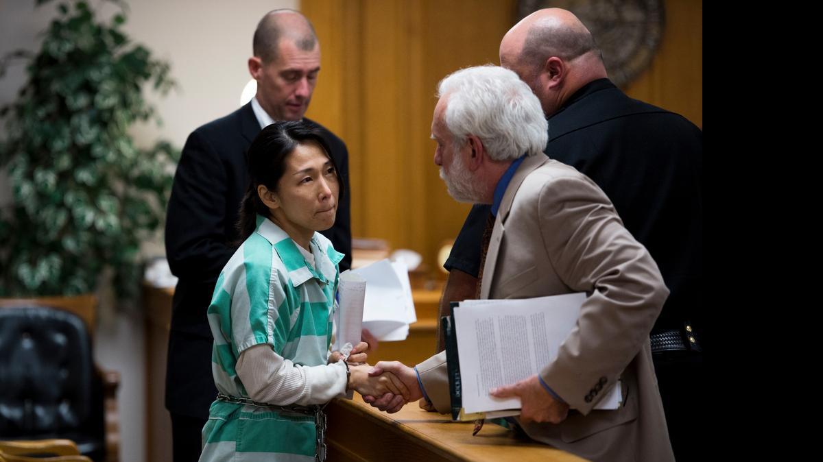 
Defense attorney Dennis Riordan, right, and immigration attorney Matthew Dirkes, left, congratulate Nan-Hui Jo, the Korean immigrant convicted last month of abducting her American-born daughter Hwi, after her conviction was reduced to a misdemeanor and she was released on probation at the Yolo County Courthouse in April. She was then taken into custody by Immigration and Customs Enforcement.
