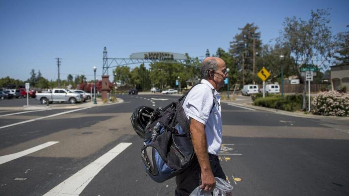 Mark Hegel, who is an employee of The Gathering Inn, makes his way through his daily route of keeping the streets clean of garbage and checking in with local homeless individuals in Roseville, Calif. Once working in sales and business development for a medical imaging company in Roseville, Hegel was hand-picked by the Inn to become a day porter because many businesses in Roseville are concerned about the cleanliness of the downtown area. He is paid $10 per hour.