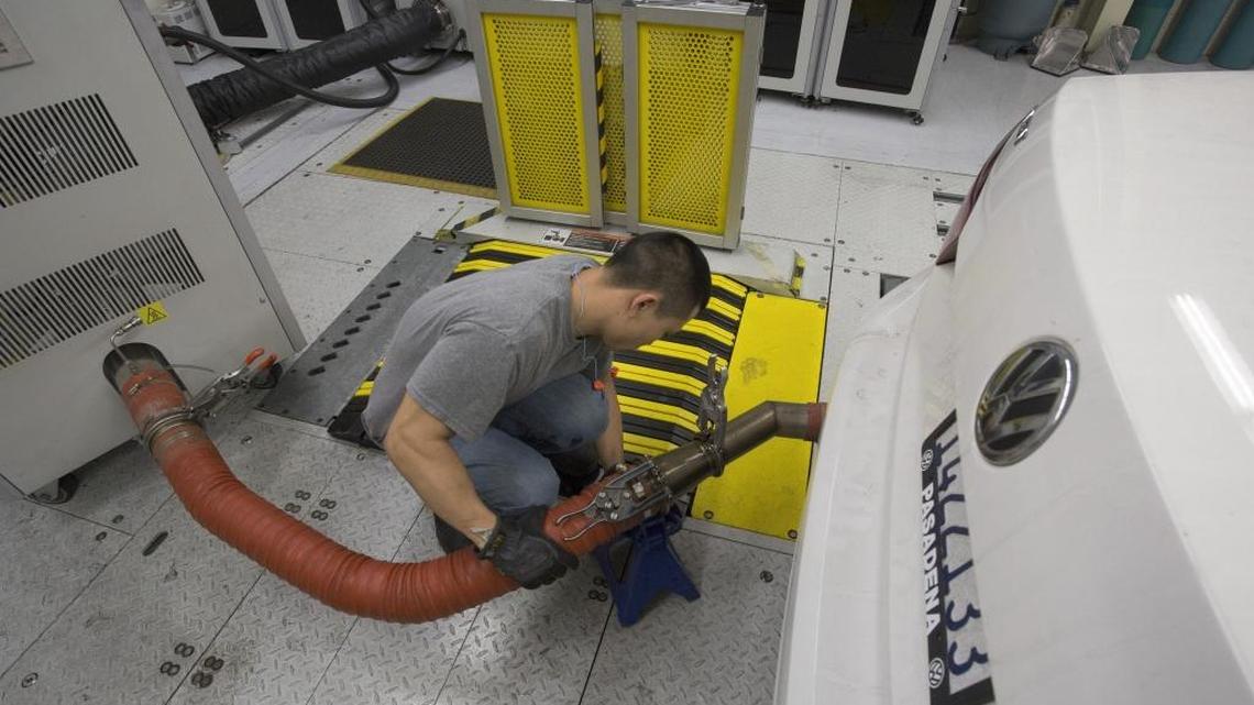 A California Air Resources Board technician tests diesel emissions of a 2013 Volkswagen Passat at CARB’s lab in El Monte in 2015. Air board staffers were pivotal in uncovering a massive diesel pollution scandal. As part of its court-approved settlement, Volkswagen is designating a “Green City” to promote nonpolluting electric cars, and has tentatively chosen Sacramento.