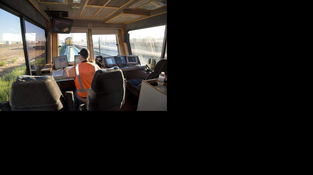 
Mike Stoddard oversees the operation of Union Pacific Railroad’s EC-4 as it makes its way out of the Roseville yard on  Oct. 6 in Roseville. The EC-4 is a 96-ton, 82-foot-long rolling track inspection car which travels 800-1500 miles a week making sure that heavily used railroad tracks are in good working order.
