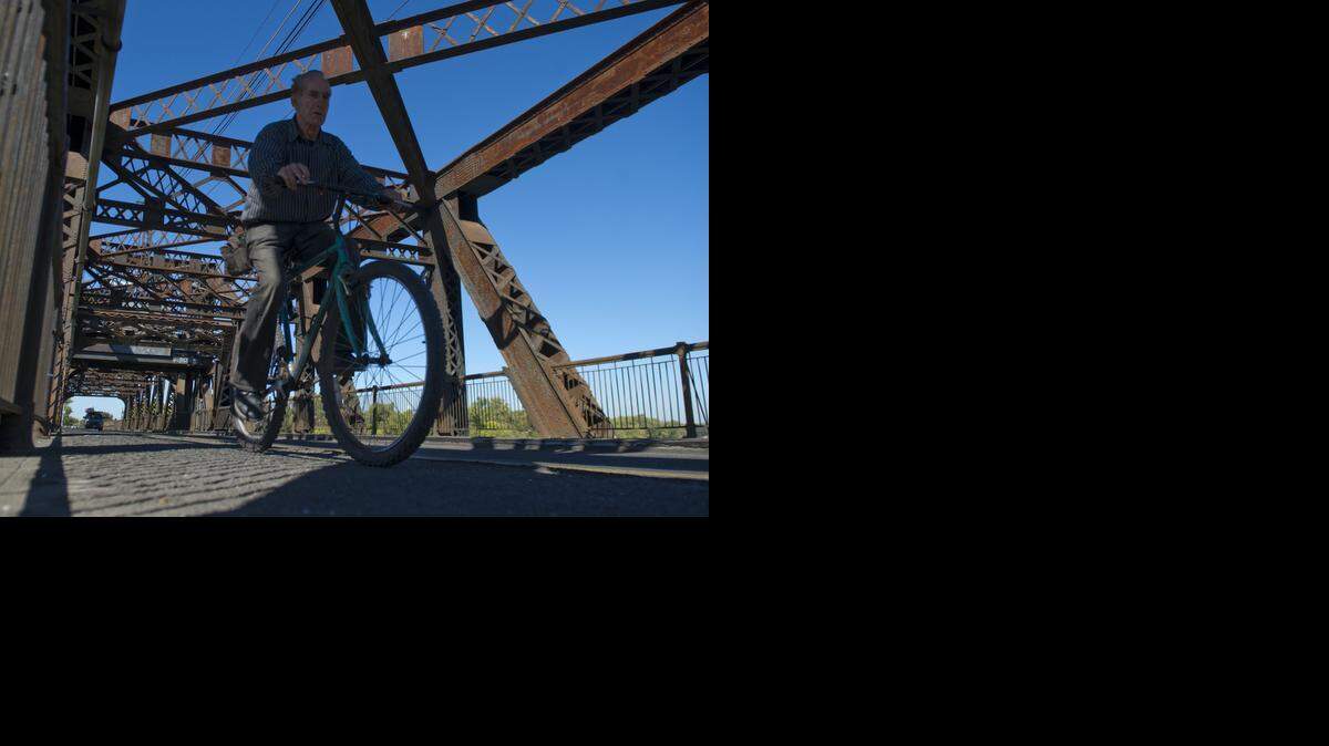 
Sacramento city officials are soliciting public opinion about their idea of reducing 12th Street from four lanes to three as it comes into downtown. The far west lane on the street would be turned into a two-way bicycling path, separated 5 feet from cars by a crosshatched area with bollards.
