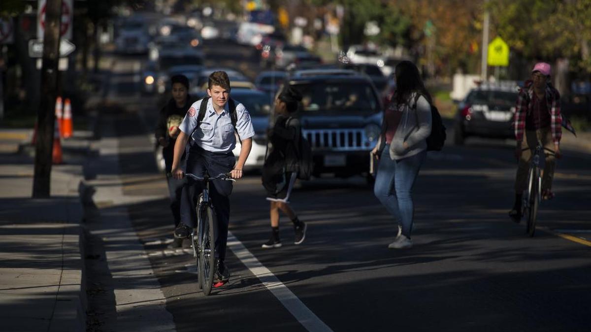 A McClatchy High student rides up Freeport Boulevard on Thursday, Nov. 17, 2016, in Sacramento, Calif. Changes to the street include bike lanes that run in front of McClatchy High School, Sacramento City College, and businesses such as Freeport Bakery and Taylor’s Market.
