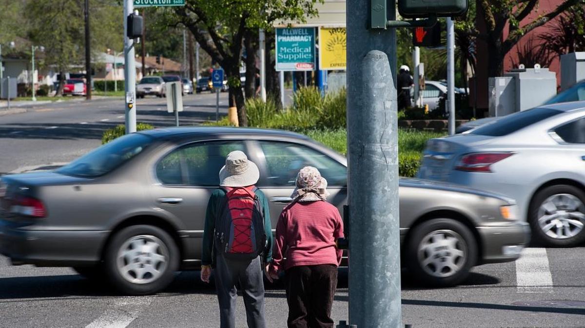 Pedestrians wait to cross the intersection at Stockton Boulevard and Fruitridge Road in Sacramento on Wednesday, March 16, 2016. A new program, Vision Zero, will target safety improvements on city streets.