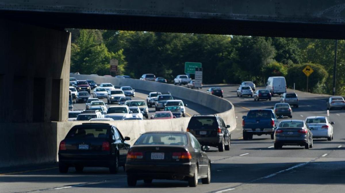 Cars heading east are backed up under the train overpass after driving past the E Street entrance to the Capital City Freeway in 2013. Traffic data say the section of the Capital City Freeway accounts for one-third of the Sacramento Valley region’s annual hours of freeway delays.
