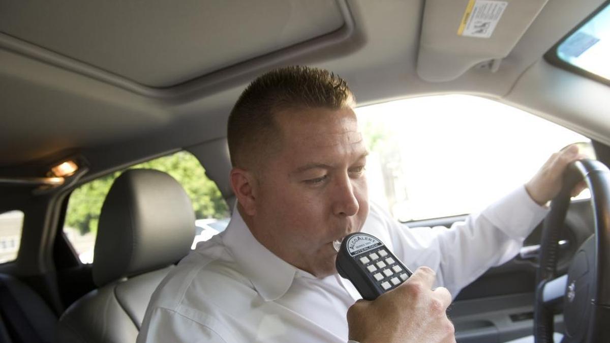 A state legislator wants to see ignition interlock devices installed for at least six months in cars of motorists convicted of a DUI. Photo of device demonstration, June 8, 2010