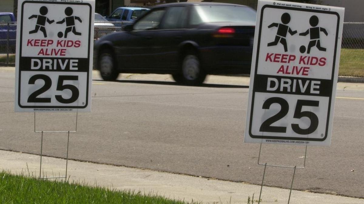 The Rusch Park Neighborhood Association kicks off the national "Keep Kids Alive, Drive 25" program, putting up lawn signs urging motorists to think more about safety and slowing down in residential neighborhoods, such as these signs on Cobalt Way in Citrus Heights, July 26, 2003.