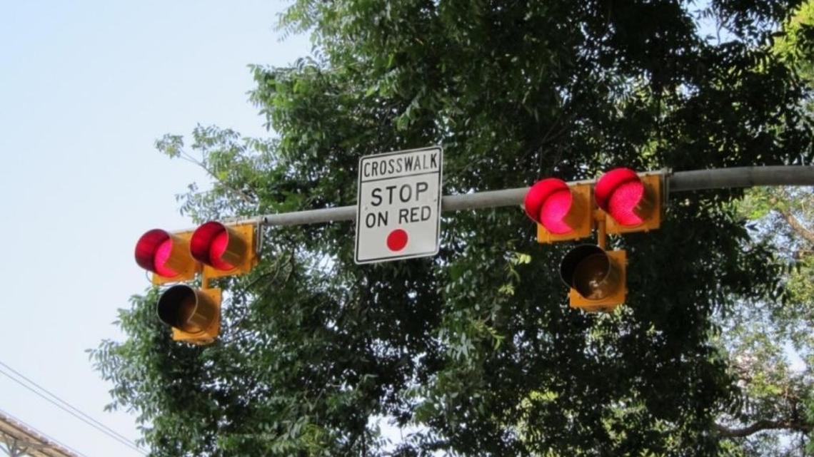 What should the fine be for a rolling right turn on a red light?