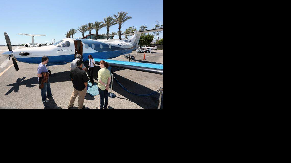 
Passengers at Bob Hope Airport in Burbank in June 2013 board a plane operated by Surf Air, an airline that offers unlimited travel to members who pay initiation and monthly fees.  Surf Air started flying between smaller airports in California, focusing on flyers who do business in Hollywood and Silicon Valley, and who would prefer doing so without the hassles of major airports. 
