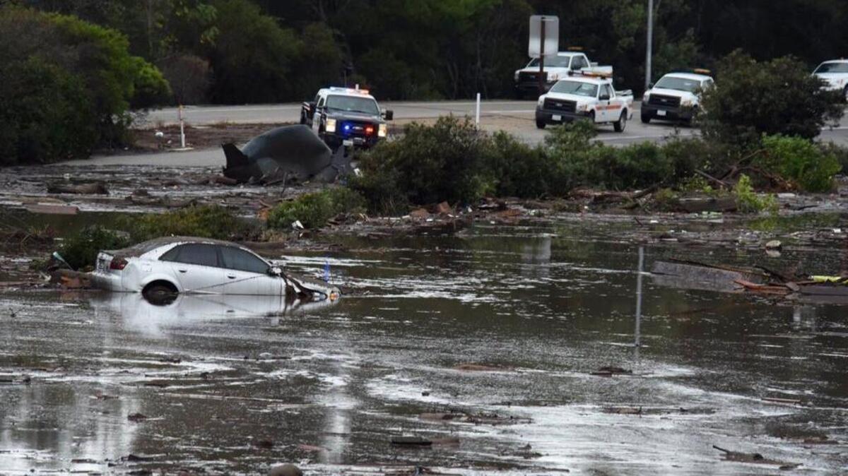 This photo provided by the Santa Barbara County Fire Department shows the U.S. Highway 101 at the Olive Mill Road overpass flooded with runoff water from Montecito Creek on Tuesday in Montecito. Dozens of homes were swept away or heavily damaged as downpours sent mud and boulders roaring down hills stripped of vegetation by a gigantic wildfire that raged in Southern California last month. (Mike Eliason/Santa Barbara County Fire Department via AP)