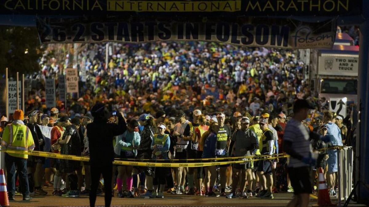 Runners line up at the start line of the the California International Marathon Sunday on December 6, 2015 in Sacramento.