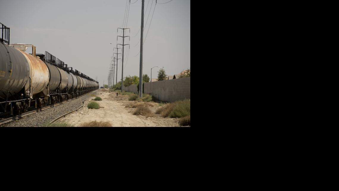 
A train carrying fuel passes through a Bakersfield neighborhood last summer. The dramatic increase in crude oil shipments around the United States and Canada, often on 100-car trains, has led to several major derailments and fires.
