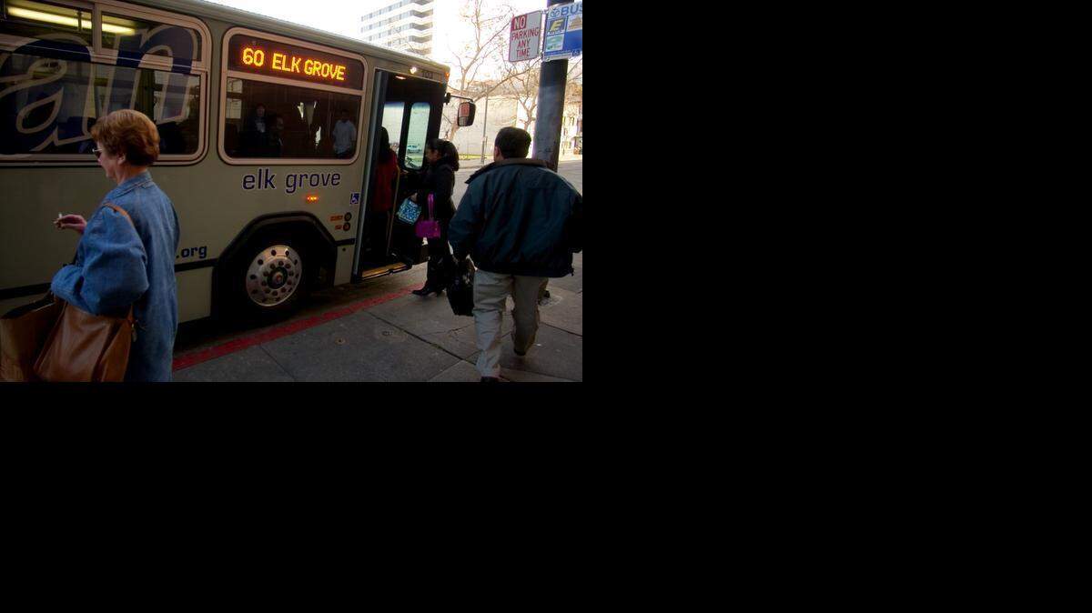 
Riders board e-tran, a bus dedicated for riders from Elk Grove, at Seventh Street and the K Street Mall. 
