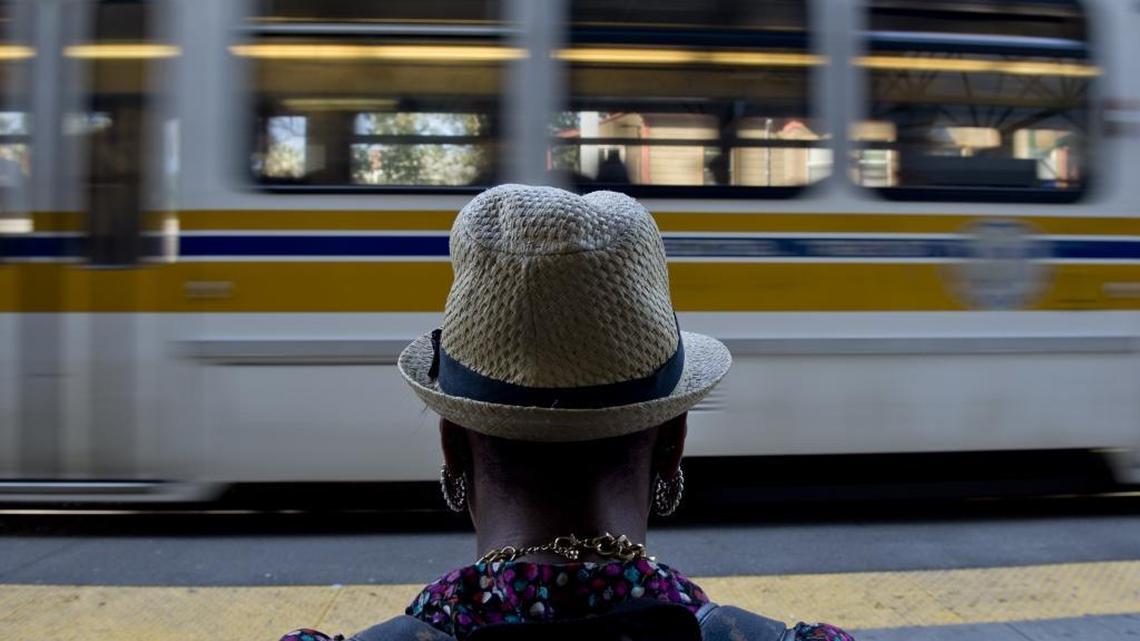 A Sacramento Regional Transit light-rail passenger waits at the 16th Street station. A proposed transportation sales tax would help fund transit.