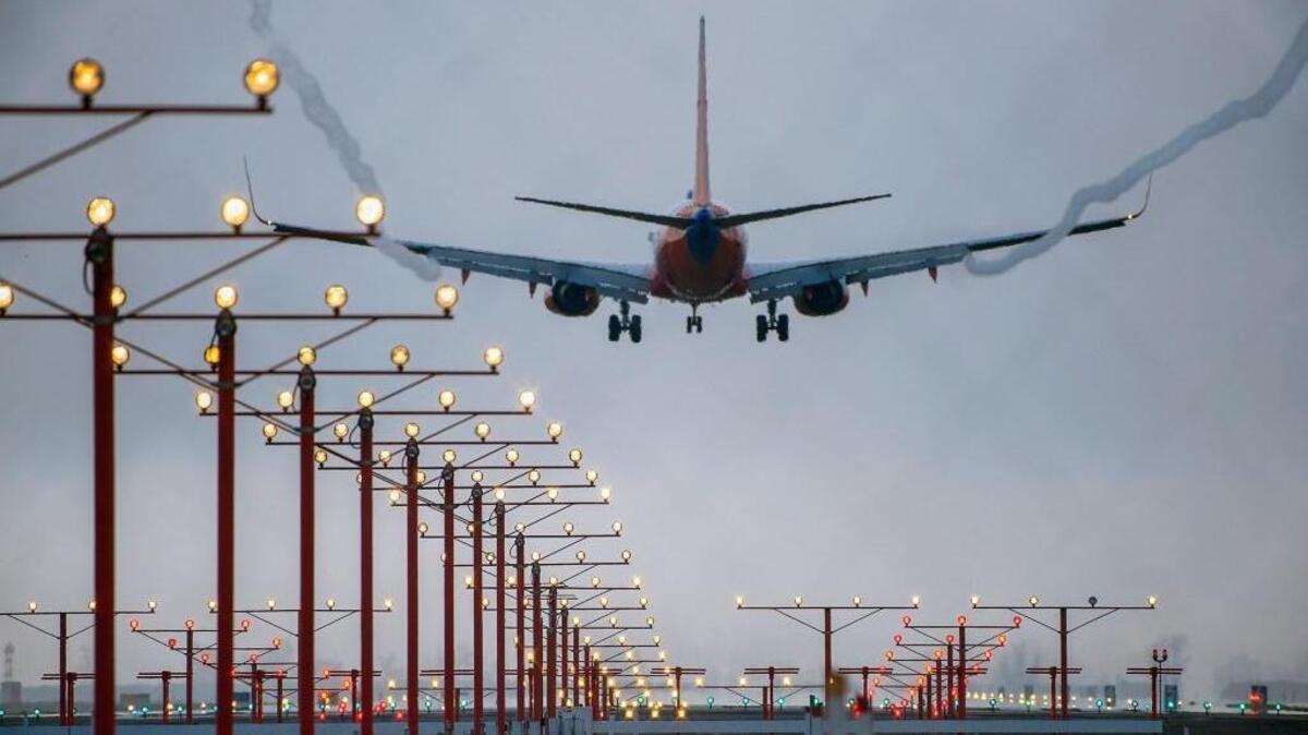 An airliner lands in January at Sacramento International Airport. Passengers this summer can expect longer waits at security checkpoints.