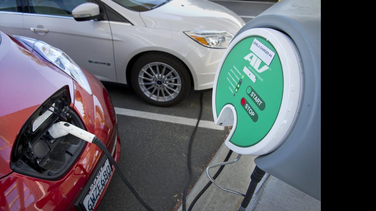 
Electric-vehicle chargers are seen at SMUD in August 2014 in Sacramento. The state on Tuesday launched a $2 million financing program that provides incentives to small-business owners and landlords to install electric-vehicle charging stations.
