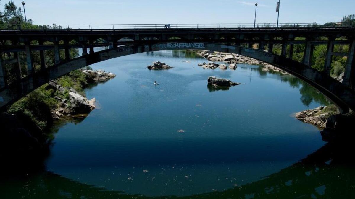 Cyclists cross the Rainbow Bridge in Folsom.