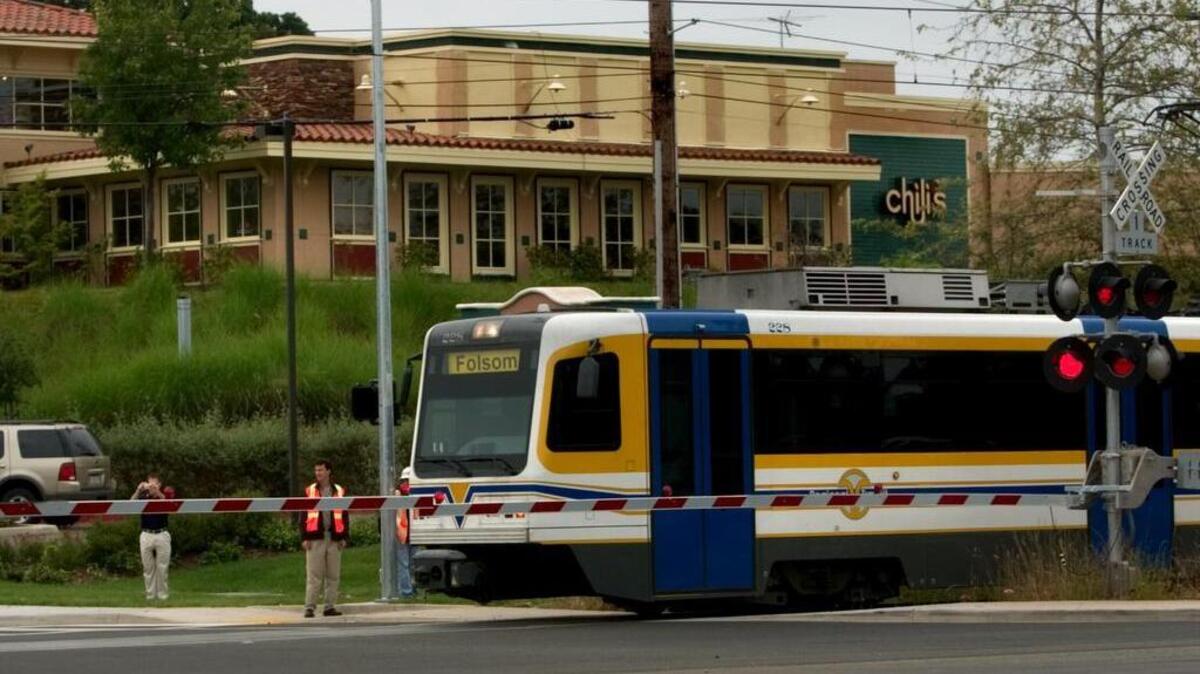 A light rail runs along Folsom Boulevard on May 17, 2005.
