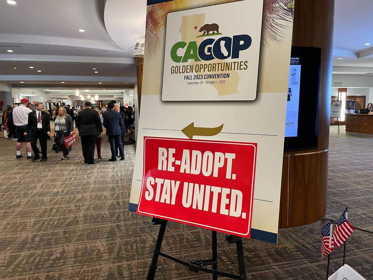 A sign urging California Republicans to re-adopt the party’s existing platform was placed over a directional marker at the state GOP convention at the Anaheim Marriott. Conservative members carried the signs ahead of a fight over efforts to modernize and streamline the California GOP policy document.