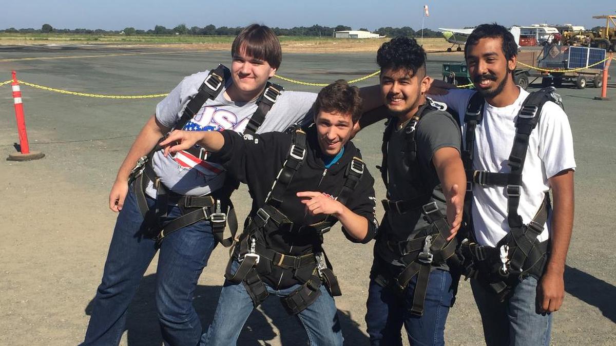 This Aug. 6 photo provided by Francine Salazar Turner shows her son Tyler Turner, second from left, with his friends Casey Nelson, left, Quinan Munoz, second from right, and Mario Muniz just before his fatal skydiving jump in Lodi.