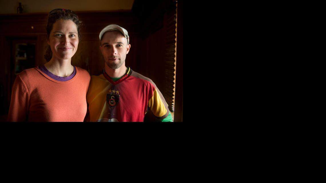 Adela Tarkowska and Kris Jozefowski pose for a portrait before their talk at Sudwerk on Saturday. They have ridden their bikes across four continents over the past five years. 
