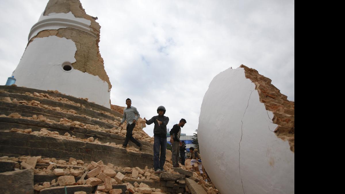 
Volunteers work to remove debris at the historic Dharahara Tower, a city landmark, after an earthquake in Kathmandu, Nepal, Saturday, April 25, 2015. A Sacramento resident was relived to find that relatives in Nepal survived the quake, though a brother’s home was destroyed. 
