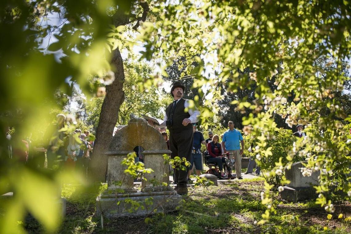 Volunteer Troy Glasson leads a tour about Victorian symbolism at Sacramento’s Historic City Cemetery in 2017.