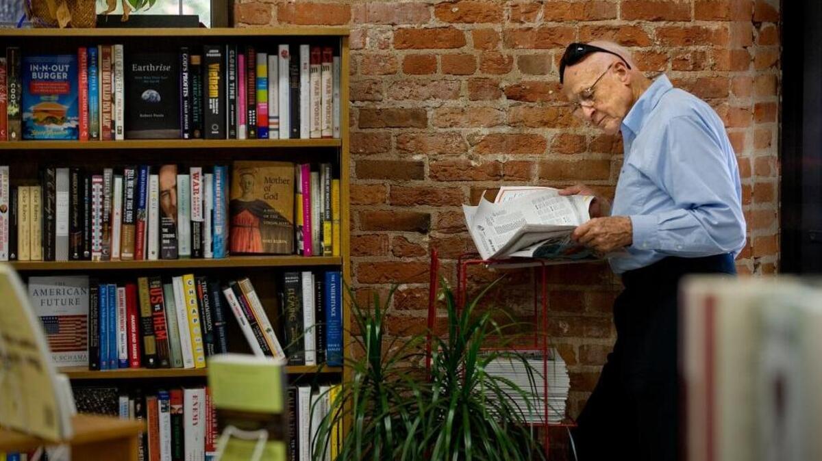 Bookstore patron Keith Seegmiller skims a periodical at the Avid Reader bookstore on Broadway in Sacramento on Thursday, Sept. 3, 2009.