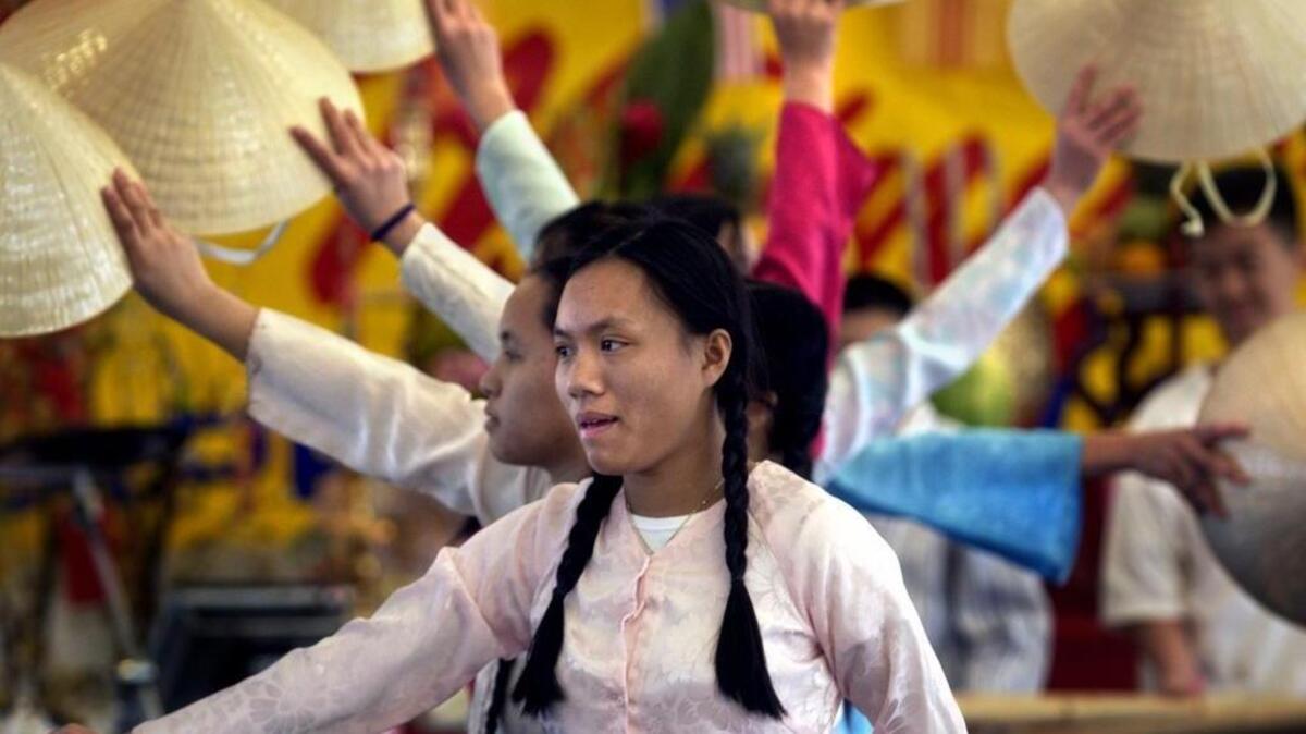 The Vietnamese Lunar New Year – or “Tet” – is celebrated this weekend in Sacramento with a parade, open-air marketplace, food festival, live performing arts and carnival games and rides. In this photo, Nhung Pham, 17, performs with the Valley High Vietnamese Student Association Union at a 2005 celebration in Sacramento.