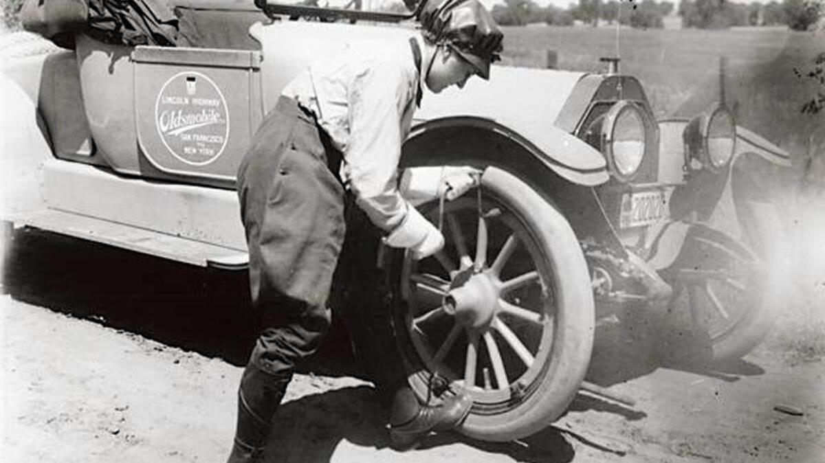 Amanda Preuss and the Oldsmobile V-8 roadster that she drove solo from Oakland to New York City in August 1916.