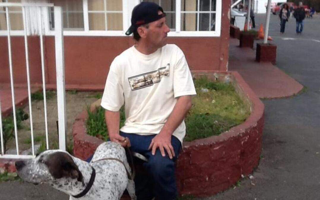 
Kurt Capozziello, 50, takes a moment with his dog, Scooby Doo, in front of Old Town Inn in West Sacramento.
