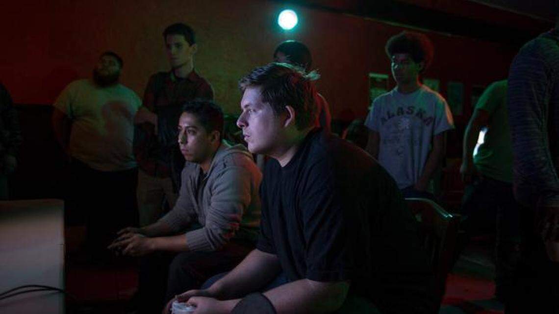 Britton Green plays against Gerardo Mendoza at the Retro Console Gaming night at Cafe Colonial in 2015.