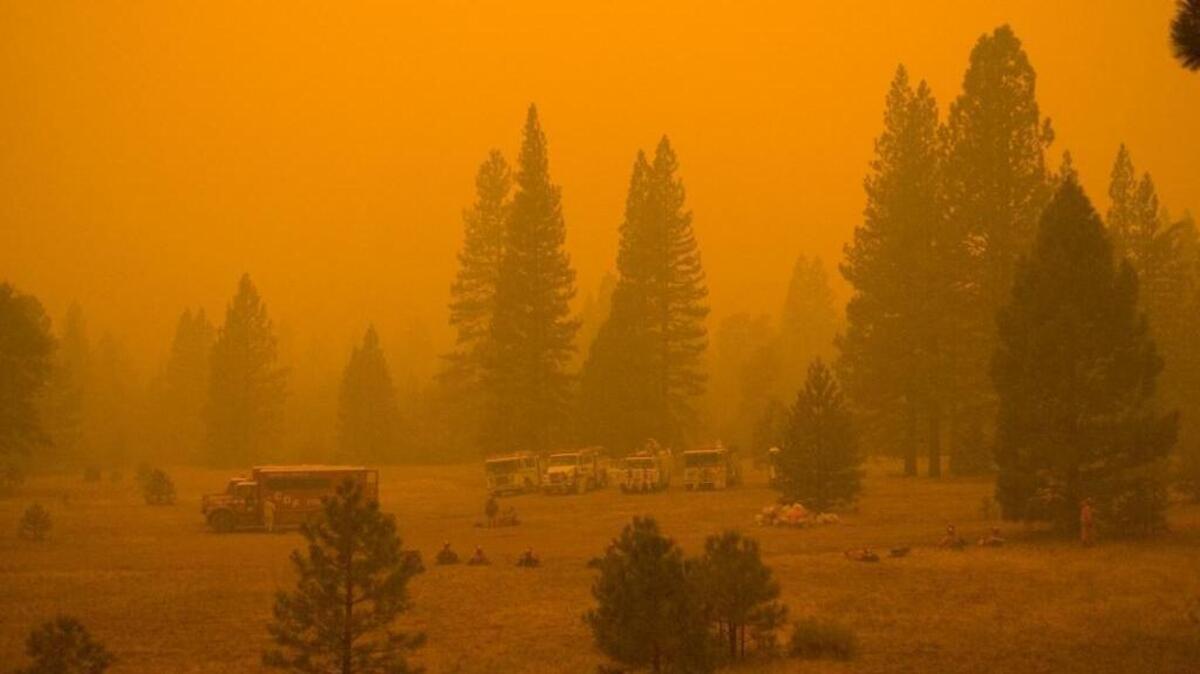 Haze hangs over firefighters battling the Moonlight fire in 2007.