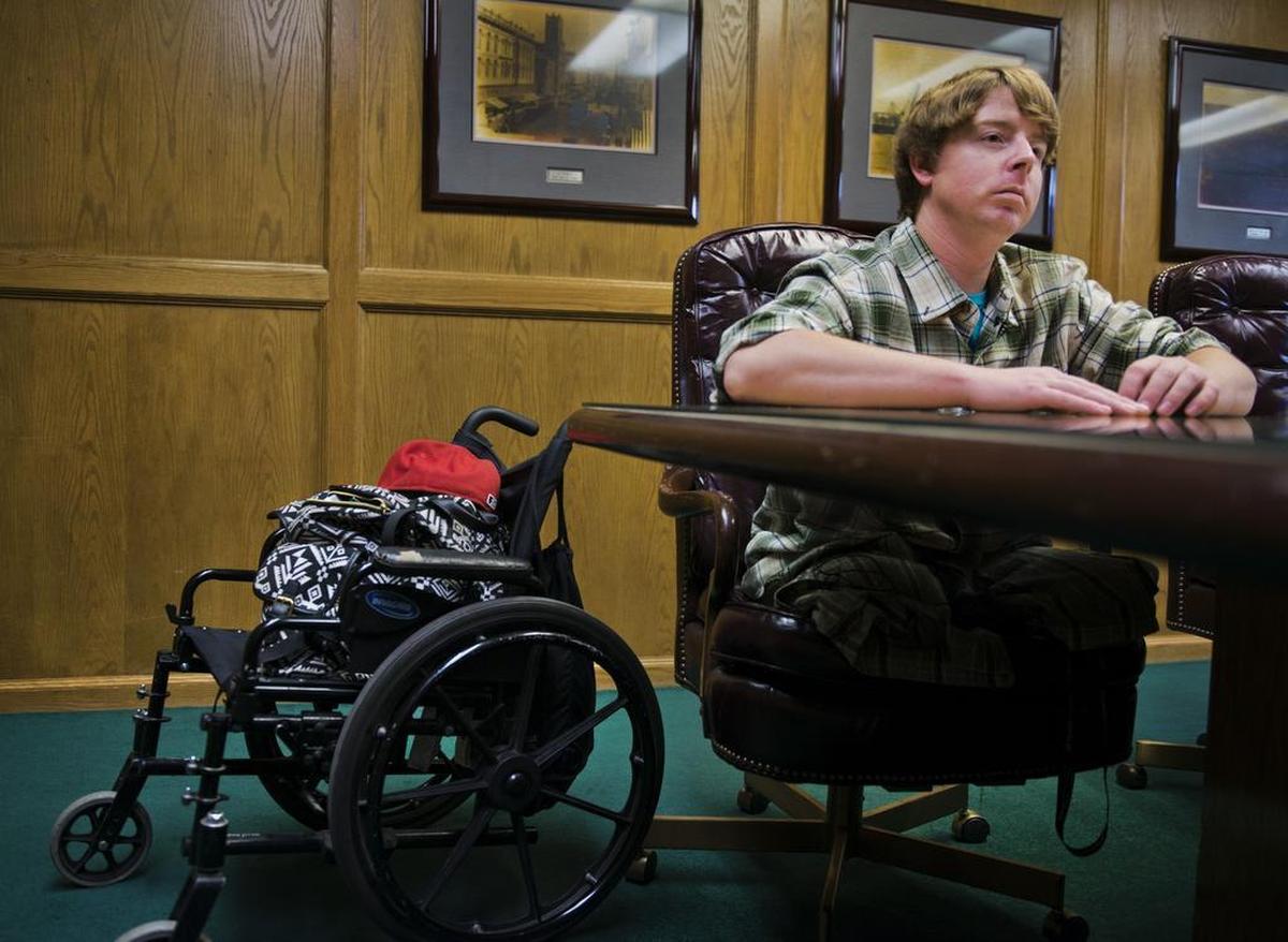 Joe Nevis of Marysville lost both of his legs after being hit by an Amtrak train last year. He is pictured in the office of his lawyer, Daniel Wilcoxen, in Sacramento on Wednesday.
