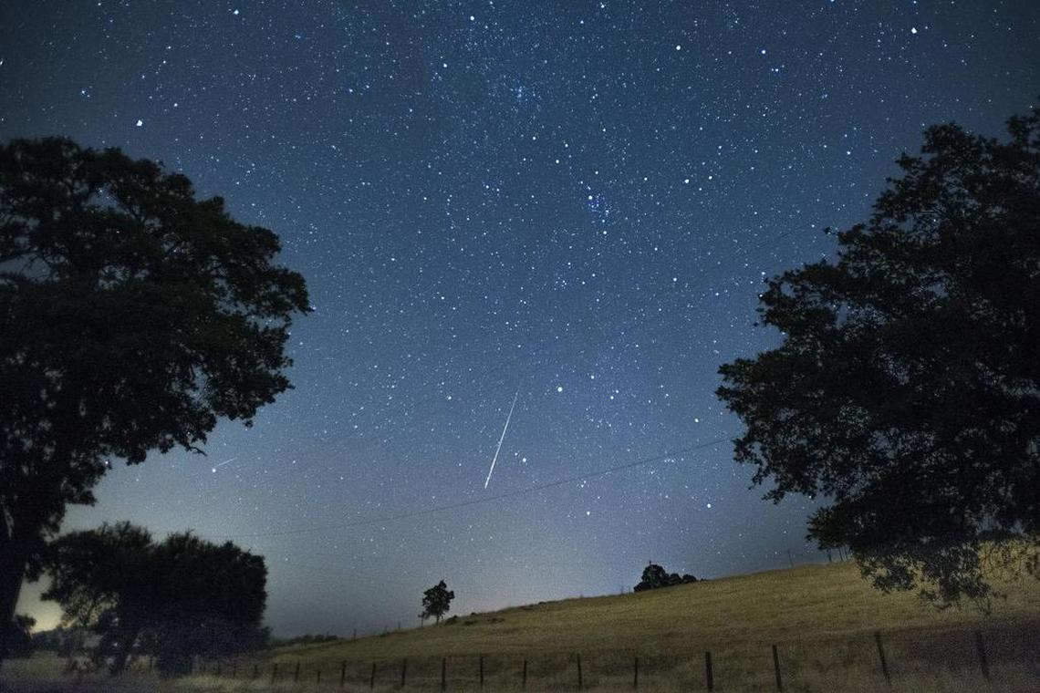A meteor streaks across the sky during the annual Perseid meteor shower in Amador county on Friday, August 12, 2016.
