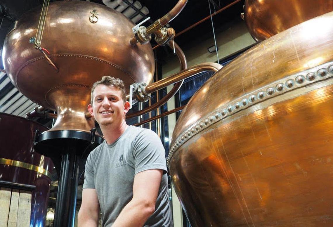Connor Vaccaro, winemaker for Bertagna Family Wineries at Durham, Butte County, alongside the still with which he makes the firm’s spirits.
