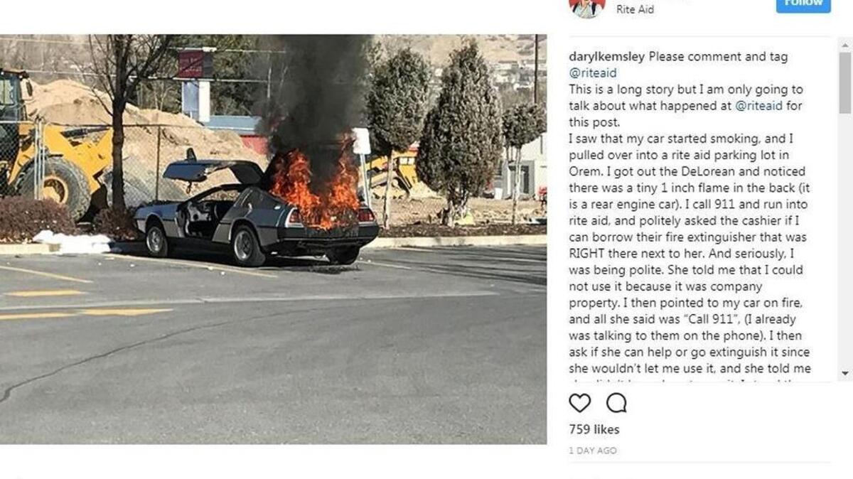 Screenshot of a burning DeLorean in a Rite Aid parking lot in Orem, Utah.