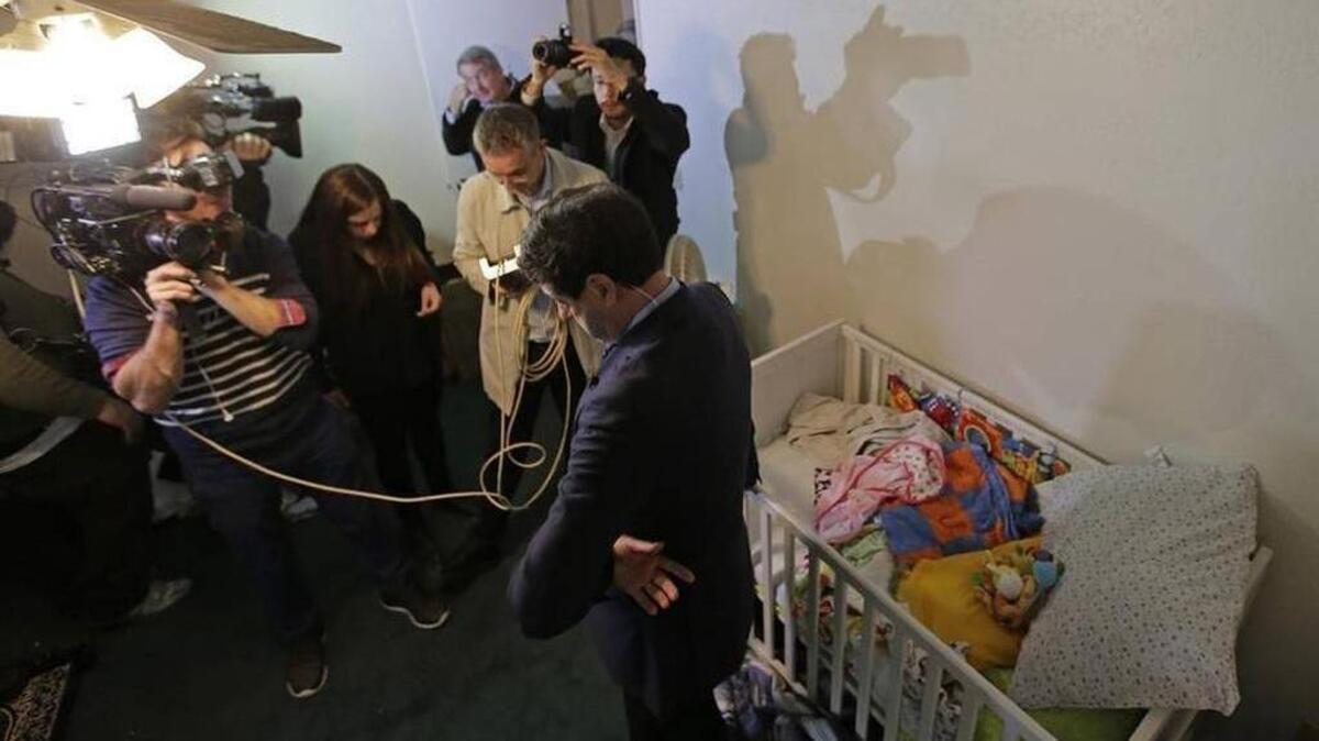 Members of the media crowd into a childs room in an apartment in Redlands, Calif., shared by San Bernardo shooting rampage suspects Syed Farook and his wife, Tashfeen Malik, Friday, Dec. 4, 2015, after the building landlord invited media into the town house rented by the California attackers.