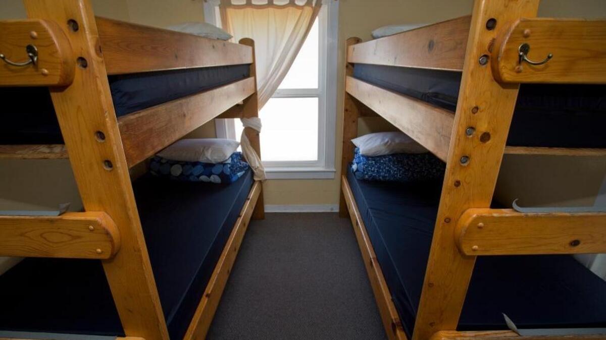 FILE -- Bunk beds fill a shared dorm-style room that sleep up to six people at the Pigeon Point Lighthouse Hostel in Pescadero, Calif., on Wednesday, May 28, 2014. A study published in January 2018 suggests writing to-do lists could potentially help people fall asleep quicker.