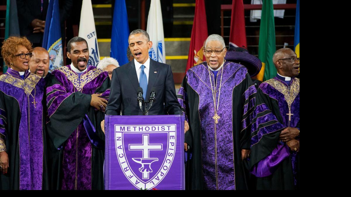
President Barack Obama sings "Amazing Grace" during services honoring the life of Rev. Clementa Pinckney, Friday, June 26, 2015, at the College of Charleston TD Arena in Charleston, S.C.. Pinckney was one of the nine people killed in the shooting at Emanuel AME Church last week in Charleston. 
