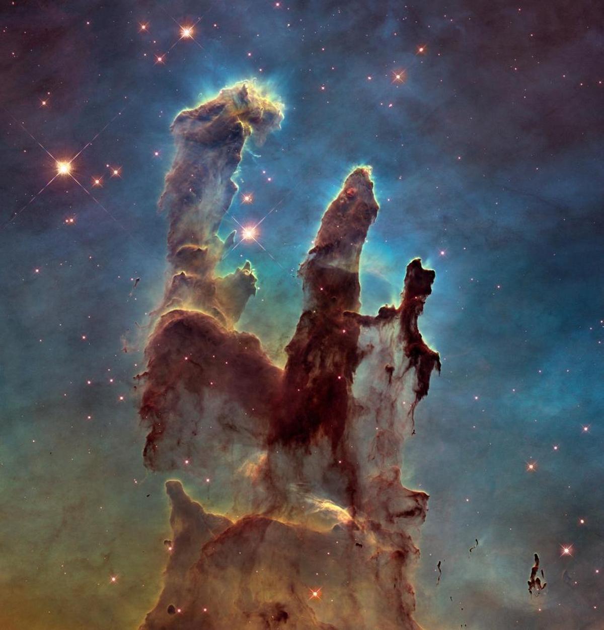 This image made by the Hubble Space Telescope shows the Eagle Nebula's “Pillars of Creation.” With more than 1 million observations, including those of the farthest and oldest galaxies ever beholden by humanity, no man-made satellite has touched as many minds or hearts as Hubble.