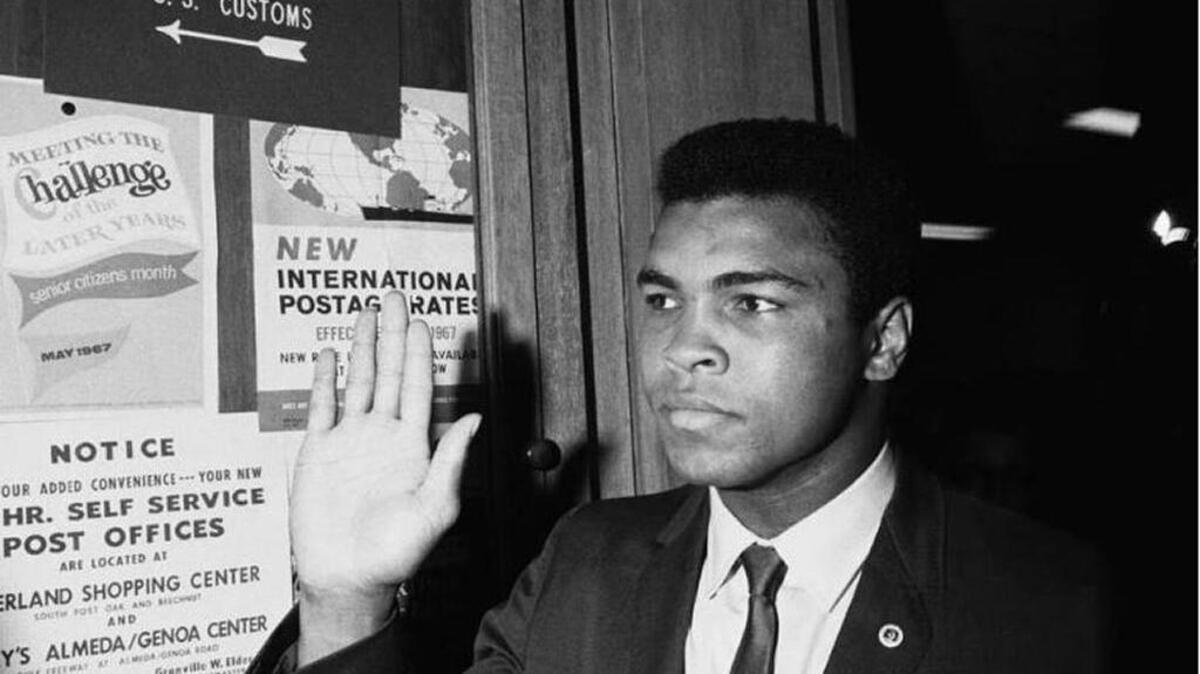 Muhammad Ali was stripped of his World Heavyweight Champion titles and banned from boxing after he refused to be inducted into the U.S. Army. He objected on religious grounds, but was convicted of draft evasion and sentenced to serve five years in prison. His conviction was overturned in 1971.
