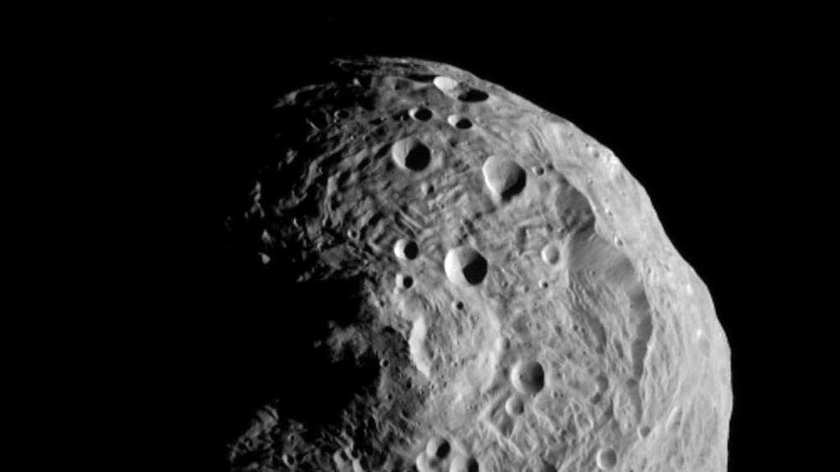 This file image released by the Jet Propulsion Laboratory on Monday, July 18, 2011 shows the asteroid Vesta, photographed by the Dawn spacecraft on July 17, 2011. Another asteroid known as 2010 WC9 will come close to Earth on Tuesday, May 15, 2018.