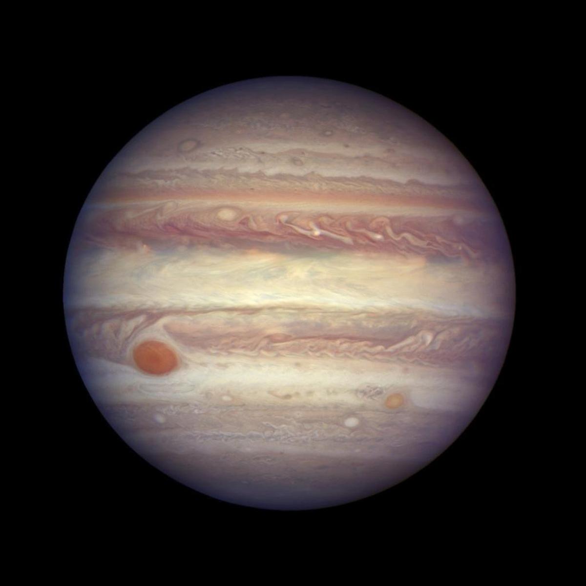 This April 3, 2016, image made available by NASA shows the planet Jupiter when it was at a distance of about 668 million kilometers (415 million miles) from Earth. Jupiter is extra close and extra bright this week, and the Hubble Space Telescope took advantage of the opportunity to make this photo of the gas giant.