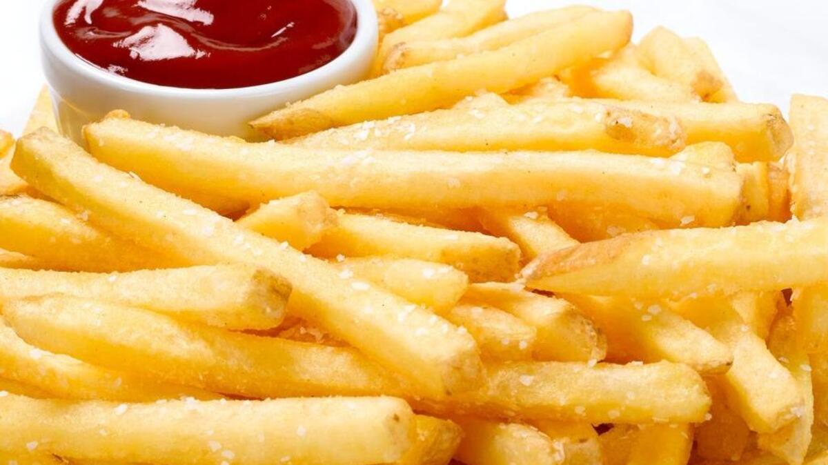 FILE - A plate of french fries with ketchup.